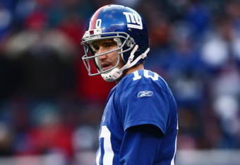 EAST RUTHERFORD, NJ -  JANUARY 11:  Eli Manning #10 of the New York Giants looks on against the Philadelphia Eagles during the NFC Divisional Playoff Game on January 11, 2009 at Giants Stadium in East Rutherford, New Jersey.  The Eagles defeated the Giants 23 -11. (Photo by Chris McGrath/Getty Images)