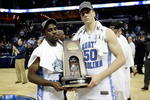 MEMPHIS, TN - MARCH 29:  (L-R) Ty Lawson #5 and Tyler Hansbrough #50 of the North Carolina Tar Heels pose with the South Regional trophy after defeating the Oklahoma Sooners during the NCAA Men's Basketball Tournament South Regional Final at the FedExForum on March 29, 2009 in Memphis, Tennessee. The Tar Heels defeated the Sooners 72-60 to advance to the Final Four.  (Photo by Joe Murphy/Getty Images)