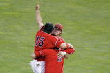 OMAHA, NE - JUNE 25:  Steve Detwiler #15 of the Fresno State Bulldogs celebrates with Erik Wetzel #3 and Alan Ahmady #9 against the Georgia Bulldogs during Game 3 of the 2008 Men's College World Series Championship June 25, 2008 at Rosenblatt Stadium in Omaha, Nebraska.  (Photo by Kevin C. Cox/Getty Images)