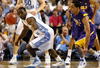 GREENSBORO, NC - MARCH 21:  Ty Lawson #5 of the North Carolina Tar Heels reaches back for a loose ball against Bo Spencer #11 of the Louisiana State University Tigers during the second round of the NCAA Division I Men's Basketball Tournament at the Greensboro Coliseum on March 21, 2009 in Greensboro, North Carolina.  (Photo by Streeter Lecka/Getty Images)