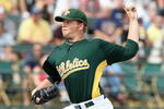 TEMPE, AZ - MARCH 08:  Starting pitcher Brett Anderson #67 of the Oakland Athletics pitches against the Cleveland Indians during the spring training game at Phoenix Municipal Stadium on March 8, 2009 in Tempe, Arizona.  The A's defeated the Indians 8-5.  (Photo by Christian Petersen/Getty Images)