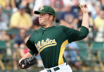 TEMPE, AZ - MARCH 08:  Starting pitcher Brett Anderson #67 of the Oakland Athletics pitches against the Cleveland Indians during the spring training game at Phoenix Municipal Stadium on March 8, 2009 in Tempe, Arizona.  The A's defeated the Indians 8-5.  (Photo by Christian Petersen/Getty Images)