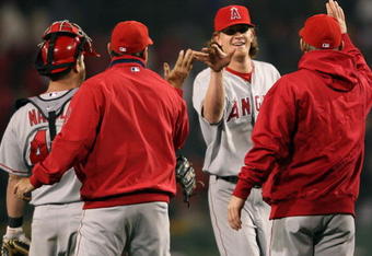 BOSTON - OCTOBER 05:  Jered Weaver #36 and Mike Napoli #44 of the Los Angeles Angels of Anaheim celebrate the win after Game Three of the American League Championship Series on October 5, 2008  at Fenway Park in Boston, Massachusetts. The Angels defeated the Red Sox 5-4 in 12 innings.  (Photo by Elsa/Getty Images)
