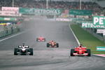 18 Mar 2001:  Michael Schumacher of Germany and Ferrari overtakes David Coulthard of Great Britain and McLaren-Mercedes into turn one during the Malaysian Formula One Grand Prix held at the Sepang International Circuit, in Kuala Lumpur, Malaysia. \ Mandatory Credit: Mark Thompson /Allsport