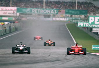 18 Mar 2001:  Michael Schumacher of Germany and Ferrari overtakes David Coulthard of Great Britain and McLaren-Mercedes into turn one during the Malaysian Formula One Grand Prix held at the Sepang International Circuit, in Kuala Lumpur, Malaysia. \ Mandatory Credit: Mark Thompson /Allsport