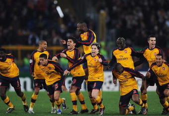 ROME - MARCH 11:  Arsenal players celebrate victory after winning on penalties during the UEFA Champions League, Round of Last 16, Second Leg match between AS Roma and Arsenal at the Stadio Olimpico on March 11, 2009 in Rome, Italy.  (Photo by Shaun Botterill/Getty Images)