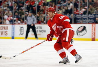 DETROIT - MARCH 12:  Johan Franzen #93 of the Detroit Red Wings skates against the Calgary Flames during the game on March 12, 2009 at Joe Louis Arena in Detroit, Michigan. (Photo by Gregory Shamus/Getty Images)