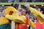 SYDNEY, AUSTRALIA - APRIL 01: Harry Kewell (L) and Tim Cahill (2nd R) of Australia embrace Joshua Kennedy (2nd L) after Kennedy scored a goal during the 2010 FIFA World Cup qualifying match between the Australian Socceroos and Uzbekistan at ANZ Stadium on April 1, 2009 in Sydney, Australia.  (Photo by Mark Nolan/Getty Images)