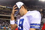 PHILADELPHIA - DECEMBER 28:  Tony Romo #9 of the Dallas Cowboys walks off the field after playing the Philadelphia Eagles on December 28, 2008 at Lincoln Financial Field in Philadelphia, Pennsylvania. The Eagles defeated the Cowboys 44-6.  (Photo by Jim McIsaac/Getty Images)