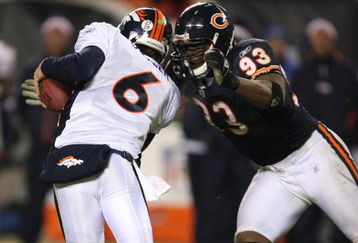 CHICAGO - NOVEMBER 25: Adewale Ogunleye #93 of the Chicago Bears sacks Jay Cutler #6 of the Denver Broncos late in regulation on November 25, 2007 at Soldier Field in Chicago, Illinois. (Photo by Jonathan Daniel/Getty Images)