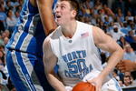 CHAPEL HILL, NC - JANUARY 09:  Tyler Hansbrough #50 of the North Carolina Tar Heels attacks the basket against Kenny George #22 of the North Carolina Asheville Bulldogs during the second half at the Dean E. Smith Center on January 9, 2008 in Chapel Hill, North Carolina.  North Carolina defeated North Carolina Asheville 93-81.  (Photo by Kevin C. Cox/Getty Images)