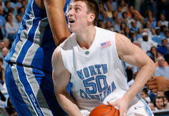 CHAPEL HILL, NC - JANUARY 09:  Tyler Hansbrough #50 of the North Carolina Tar Heels attacks the basket against Kenny George #22 of the North Carolina Asheville Bulldogs during the second half at the Dean E. Smith Center on January 9, 2008 in Chapel Hill, North Carolina.  North Carolina defeated North Carolina Asheville 93-81.  (Photo by Kevin C. Cox/Getty Images)