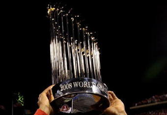 PHILADELPHIA - OCTOBER 29:  Jimmy Rollins #11 of the Philadelphia Phillies celebrates with the World Series Championship trophy after their 4-3 win against the Tampa Bay Rays during the continuation of game five of the 2008 MLB World Series on October 29, 2008 at Citizens Bank Park in Philadelphia, Pennsylvania.  (Photo by Pool/Getty Images)