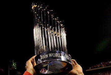 PHILADELPHIA - OCTOBER 29:  Jimmy Rollins #11 of the Philadelphia Phillies celebrates with the World Series Championship trophy after their 4-3 win against the Tampa Bay Rays during the continuation of game five of the 2008 MLB World Series on October 29, 2008 at Citizens Bank Park in Philadelphia, Pennsylvania.  (Photo by Pool/Getty Images)
