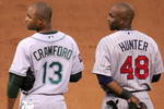 SAN FRANCISCO - JULY 10:  American League All-Stars Carl Crawford #13 of the Tampa Bay Devil Rays and Torii Hunter #48 of the Minnesota Twins stand attended during the singing of 'God Bless America' in the 78th Major League Baseball All-Star Game at AT&T Park on July 10, 2007 in San Francisco, California.  (Photo by Justin Sullivan/Getty Images)
