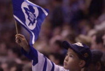 3 May 2001: A Toronto Maple Leafs fan waves a Leaf flag during game 4 of the Eastern Conference Semifinals against the New Jersey Devils at the Air Canada Center in Toronto, Ontario, Canada. The Leafs won 3-1. DIGITAL IMAGE. Mandatory Credit: Harry How/ALLSPORT