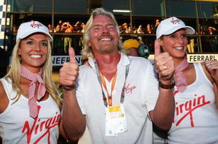 MELBOURNE, AUSTRALIA - MARCH 29:  Sir Richard Branson celebrates as Jenson Button of Great Britain and Brawn GP wins the Australian Formula One Grand Prix at the Albert Park Circuit on March 29, 2009 in Melbourne, Australia.  (Photo by Clive Mason/Getty Images)