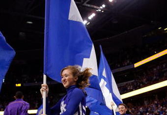 TAMPA, FL - MARCH 13:  Cheerleaders of the Kentucky Wildcats cheer before the game against the Louisiana State University Tigers during the second round of the SEC Men's Basketball Tournament on March 13, 2009 at The St. Pete Times Forum in Tampa, Florida.  (Photo by Chris Graythen/Getty Images)