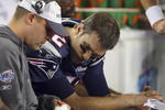 GLENDALE, AZ - FEBRUARY 03:  Quarterback Tom Brady #12 of of the New England Patriots sits on the bench with Offensive Coordinator Josh McDaniels during the fourth quarter of Super Bowl XLII against the New York Giants on February 3, 2008 at the University of Phoenix Stadium in Glendale, Arizona.  (Photo by Donald Miralle/Getty Images)