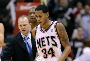 EAST RUTHERFORD, NJ - NOVEMBER 07:  Devin Harris #34 is helped from the court by Lawrence Frank, head coach of the New Jersey Nets during a game against of the Detroit Pistons November 7, 2008 at the Izod Arena in East Rutherford, New Jersey.  (Photo by Jeff Zelevansky/Getty Images)