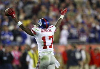 GLENDALE, AZ - FEBRUARY 03:  Wide receiver Plaxico Burress #17 of the New York Giants celebrates after catching a 13-yard touchdown pass in the fourth quarter against the New England Patriots during Super Bowl XLII on February 3, 2008 at the University of Phoenix Stadium in Glendale, Arizona.  The Giants defeated the Patriots 17-14. (Photo by Donald Miralle/Getty Images)