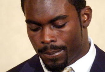 RICHMOND, VA - AUGUST 27:  Atlanta Falcons quarterback Michael Vick speaks to reporters at the Omni Richmond Hotel after agreeing to a guilty plea on charges stemming from his involvement in a dogfighting ring August 27, 2007, in Richmond, Virginia.  (Photo by Jonathan Ernst/Getty Images)