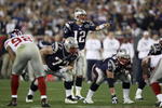 GLENDALE, AZ - FEBRUARY 03:  Quarterback Tom Brady #12 of the New England Patriots directs the offense at the line of scrimmage against the New York Giants during Super Bowl XLII on February 3, 2008 at the University of Phoenix Stadium in Glendale, Arizona.  (Photo by Andy Lyons/Getty Images)