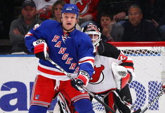 NEW YORK - MARCH 30: Sean Avery #16 of the New York Rangers pushes on Goalkeeper Martin Brodeur #30 of the New Jersey Devils during their game on March 30, 2009 at Madison Square Garden in New York City.  (Photo by Chris McGrath/Getty Images)
