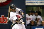 MINNEAPOLIS, MN- SEPTEMBER 28: Delmon Young #21 of the Minnesota Twins singles in the seventh inning scoring Alexi Casilla and Joe Mauer in a game against the Kansas City Royals at the Metrodome on September 28, 2008 in Minneapolis, Minnesota. The Twins defeated the Royals 6-0. (Photo by Scott A. Schneider/Getty Images)