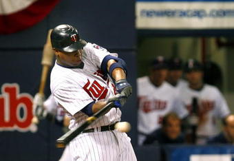 MINNEAPOLIS, MN- SEPTEMBER 28: Delmon Young #21 of the Minnesota Twins singles in the seventh inning scoring Alexi Casilla and Joe Mauer in a game against the Kansas City Royals at the Metrodome on September 28, 2008 in Minneapolis, Minnesota. The Twins defeated the Royals 6-0. (Photo by Scott A. Schneider/Getty Images)