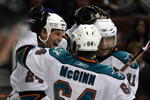 ANAHEIM, CA - MARCH 15:  Travis Moen #24 of the San Jose Sharks celebrates his second period goal with teammates Jamie McGinn #64 and Marcel Goc #11 during the NHL game against the Anaheim Ducks at Honda Center on March 15, 2009 in Anaheim, California.  (Photo by Victor Decolongon/Getty Images)
