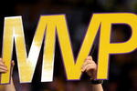 LOS ANGELES, CA - MAY 07:  A fan holds up an MVP sign as Kobe Bryant #24 of the Los Angeles Lakers is awarded the MVP trophy during the Lakers' win over the Utah Jazz in Game Two of the Western Conference Semifinals during the 2008 NBA Playoffs on May 7, 2008 at Staples Center in Los Angeles, California.  NOTE TO USER: User expressly acknowledges and agrees that, by downloading and/or using this Photograph, user is consenting to the terms and conditions of the Getty Images License Agreement.  (Photo by Stephen Dunn/Getty Images)