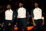 PHOENIX - FEBRUARY 15:  (L-R) Dwyane Wade, LeBron James and Kobe Bryant, members of the women's and men's gold medal winning USA Olympic basketball teams, wave to the crowd during half time of the 58th NBA All-Star Game, part of 2009 NBA All-Star Weekend at US Airways Center on February 15, 2009 in Phoenix, Arizona.  NOTE TO USER: User expressly acknowledges and agrees that, by downloading and or using this photograph, User is consenting to the terms and conditions of the Getty Images License Agreement.  (Photo by Ronald Martinez/Getty Images)