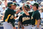PEORIA, AZ - MARCH 07:  Ryan Sweeney #15 of the Oakland Athletics is congratulated by Bob Geren after hitting a home run during the spring training game against the San Diego Padres at Peoria Stadium on March 7, 2009 in Peoria, Arizona. The A's defeated the Padres 15-6.  (Photo by Christian Petersen/Getty Images)