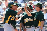 PEORIA, AZ - MARCH 07:  Ryan Sweeney #15 of the Oakland Athletics is congratulated by Bob Geren after hitting a home run during the spring training game against the San Diego Padres at Peoria Stadium on March 7, 2009 in Peoria, Arizona. The A's defeated the Padres 15-6.  (Photo by Christian Petersen/Getty Images)