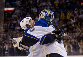 ST. LOUIS, MO. - MARCH 28: Chris Mason #50 and Dan Hinote #13 both of the St. Louis Blues celebrate after beating the Columbus Bluejackets in a shootout at the Scottrade Center on March 28, 2009 in St. Louis, Missouri.  The Blues won 4-3 in a shootout.  (Dilip Vishwanat/Getty Images)