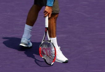 KEY BISCAYNE, FL - APRIL 03:  Roger Federer of Switzerland breaks his racquet while playing against Novak Djokovic of Serbia during the men's semifinal of the Sony Ericsson Open at the Crandon Park Tennis Center on April 3, 2009 in Key Biscayne, Florida.  (Photo by Matthew Stockman/Getty Images)