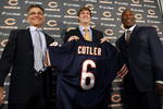 LAKE FOREST, IL - APRIL 3:  Chicago Bears general manager Jerry Angelo, quarterback Jay Cutler and head coach Lovie Smith are all smiles after introducing Cutler as their new quarterback during a press conference on April 3, 2009 at Halas Hall in Lake Forest, Illinois. (Photo by Jim Prisching/Getty Images)