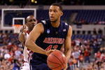 INDIANAPOLIS - MARCH 27:  Jamelle Horne #42 of the Arizona Wildcats looks to pass the ball against Andre McGee #33 of the Louisville Cardinals  during the third round of the NCAA Division I Men's Basketball Tournament at the Lucas Oil Stadium on March 27, 2009 in Indianapolis, Indiana. Louisville won 103-64.  (Photo by Andy Lyons/Getty Images)
