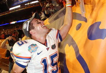 MIAMI - JANUARY 08:  Quarterback Tim Tebow #15 of the Florida Gators celebrates with fans after defeating the Oklahoma Sooners in the FedEx BCS National Championship Game at Dolphin Stadium on January 8, 2009 in Miami, Florida. The Gators won the game by a score of 24-14.  (Photo by Donald Miralle/Getty Images)