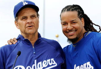 GLENDALE, AZ - MARCH 05:  Manny Ramirez #99 (L) of the Los Angeles Dodgers and manager Joe Torre #6 speak during a news conference on March 5, 2009, at Camelback Ranch in Glendale, Arizona. Ramirez signed a $45 million two-year contract on Wednesday.  (Photo by Kevork Djansezian/Getty Images)