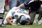 EAST RUTHERFORD, NJ - OCTOBER 05:  Quarterback Matt Hasselbeck #8 of the Seattle Seahawks is tended to by a trainer in the first half against the New York Giants at Giants Stadium on October 5, 2008 in East Rutherford, New Jersey. The Giants won 44-6.  (Photo by Jarrett Baker/Getty Images)