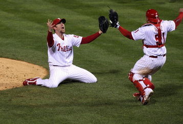 PHILADELPHIA - OCTOBER 29:  Brad Lidge #54 (L) and Carlos Ruiz #51 of the Philadelphia Phillies celebrate the final out of their 4-3 win to win the World Series against the Tampa Bay Rays during the continuation of game five of the 2008 MLB World Series on October 29, 2008 at Citizens Bank Park in Philadelphia, Pennsylvania.  (Photo by Jim McIsaac/Getty Images)