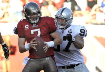 TAMPA, FL - DECEMBER 28: Defensive end Greyson Gunheim #97 of the Oakland Raiders sacks quarterback Jeff Garcia #7 of the Tampa Bay Buccaneers at Raymond James Stadium on December 28, 2008 in Tampa, Florida.  (Photo by Al Messerschmidt/Getty Images)