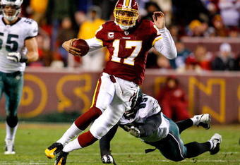 LANDOVER, MD - DECEMBER 21:  Quarterback Jason Campbell #17 of the Washington Redskins rushes upfield away from Victor Abiamiri #95 of the Philadelphia Eagles during the game on December 21, 2008 at FedEx Field in Landover, Maryland.  (Photo by Kevin C. Cox/Getty Images)