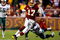LANDOVER, MD - DECEMBER 21:  Quarterback Jason Campbell #17 of the Washington Redskins rushes upfield away from Victor Abiamiri #95 of the Philadelphia Eagles during the game on December 21, 2008 at FedEx Field in Landover, Maryland.  (Photo by Kevin C. Cox/Getty Images)