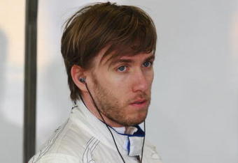 MELBOURNE, AUSTRALIA - MARCH 27:  Nick Heidfeld of Germany and BMW Sauber prepares in his team garage before driving during practice for the Australian Formula One Grand Prix at the Albert Park Circuit on March 27, 2009 in Melbourne, Australia.  (Photo by Clive Mason/Getty Images)