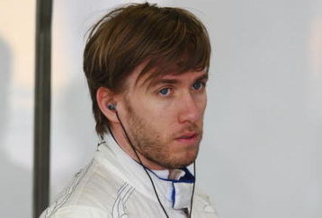 MELBOURNE, AUSTRALIA - MARCH 27:  Nick Heidfeld of Germany and BMW Sauber prepares in his team garage before driving during practice for the Australian Formula One Grand Prix at the Albert Park Circuit on March 27, 2009 in Melbourne, Australia.  (Photo by Clive Mason/Getty Images)
