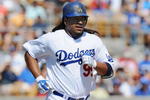 GLENDALE, AZ - MARCH 13:   Manny Ramirez #99 of the Los Angeles Dodgers runs to first base after a walk during a Spring Training game against the Texas Rangers on March 13, 2009 at Camelback Ranch in Glendale, Arizona.  (Photo by Lisa Blumenfeld/Getty Images)