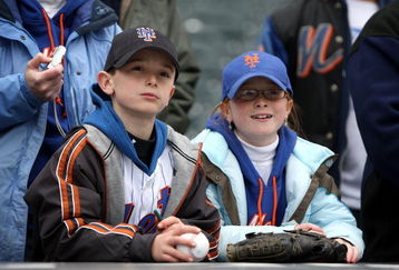 NEW YORK - APRIL 04:  Two young Mets fans watch batting practice before the New York Mets game against the Boston Red Sox on April 4, 2009 at Citi Field in the Flushing neighborhood of the Queens borough of New York City.  (Photo by Ezra Shaw/Getty Images)